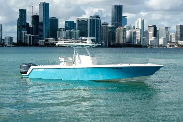 The Image of 2019 Contender 32 ST boat on water with city skyline in background. - 1