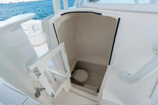 Slide: The Image of 2019 Contender 32 ST boat with open marine toilet compartment. - 9