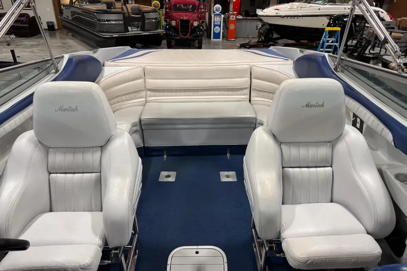 Slide: The Image of Interior of a 1998 Mariah 272 Shabah boat with white leather seating. - 10