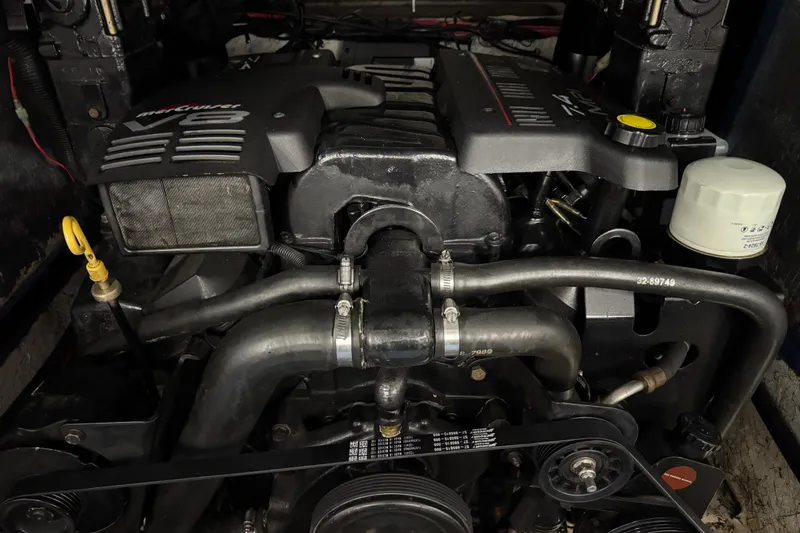 Slide: The Image of Engine of a 1998 Mariah 272 Shabah boat, featuring a V8 configuration. - 16