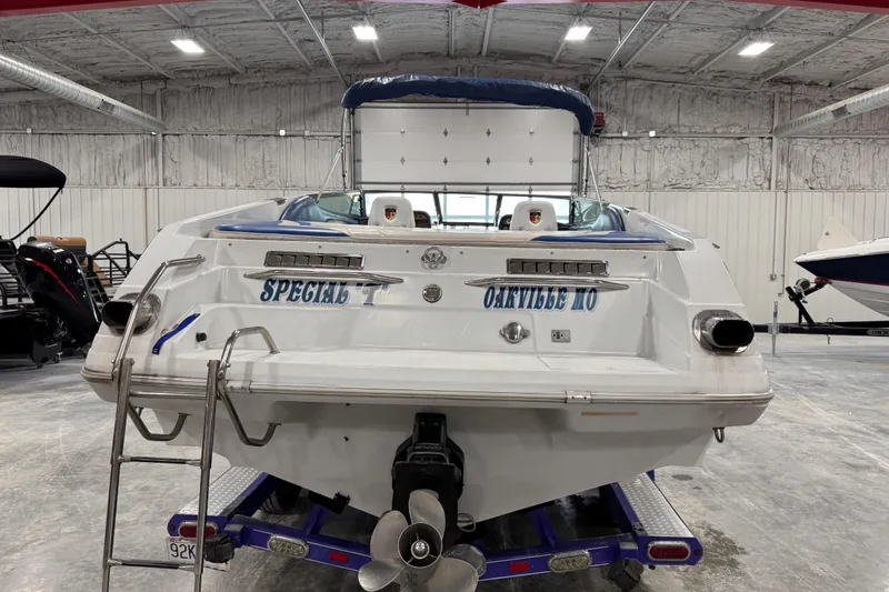 Slide: The Image of 1998 Mariah 272 Shabah boat in a garage, labeled "Special T" from Oakville, MO. - 3