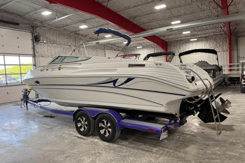 Slide: The Image of 1998 Mariah 272 Shabah boat on trailer in indoor storage facility. - 4