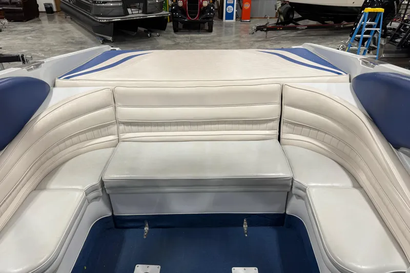 Slide: The Image of Interior of a 1998 Mariah 272 Shabah boat with white and blue seating. - 7
