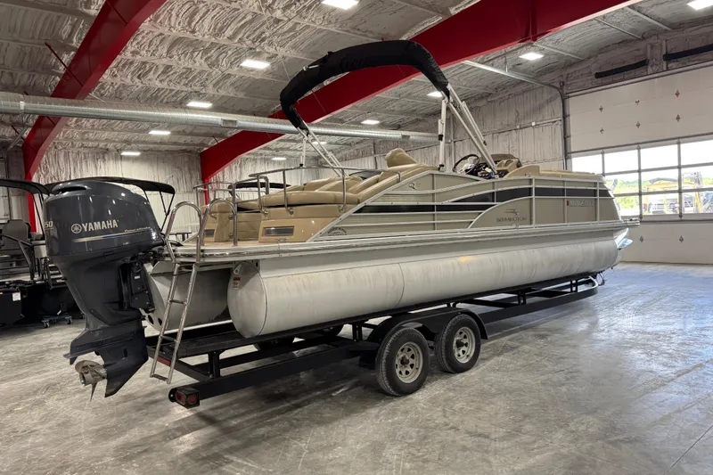 Slide: The Image of 2012 Bennington 25 QCW pontoon boat with Yamaha motor in a warehouse setting. - 3