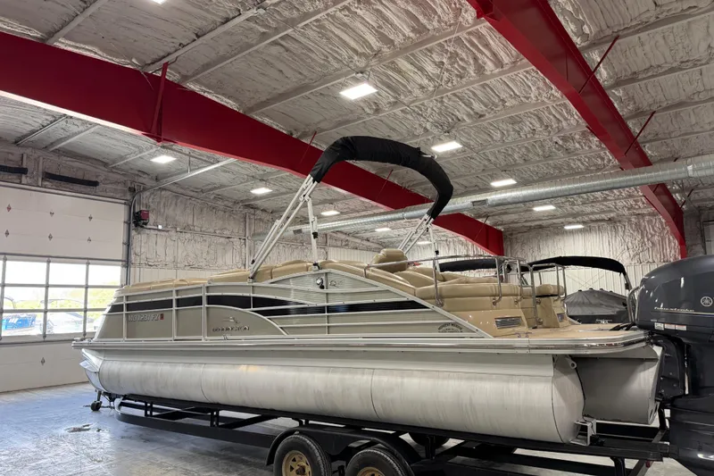 Slide: The Image of 2012 Bennington 25 QCW pontoon boat in indoor storage facility. - 4