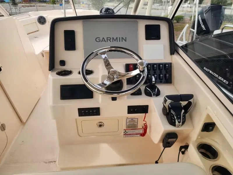 Slide: The Image of Helm console of Grady-White Freedom 285 boat, year 2026. - 22