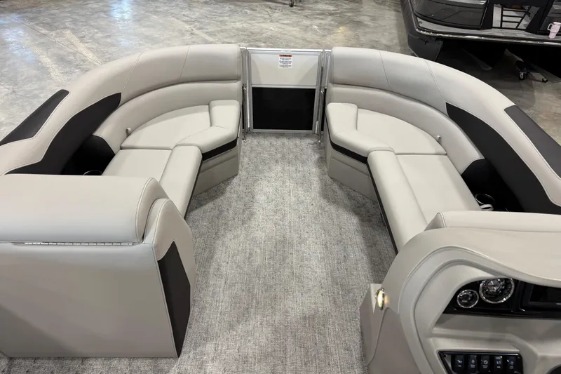 Slide: The Image of Interior of 2026 Berkshire 24 RFX LE pontoon boat with luxurious seating and modern dashboard. - 11