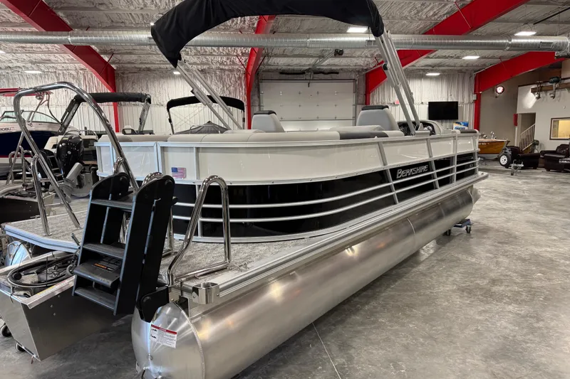 Slide: The Image of 2026 Berkshire 24 RFX LE pontoon boat in a showroom, featuring sleek design and modern amenities. - 3