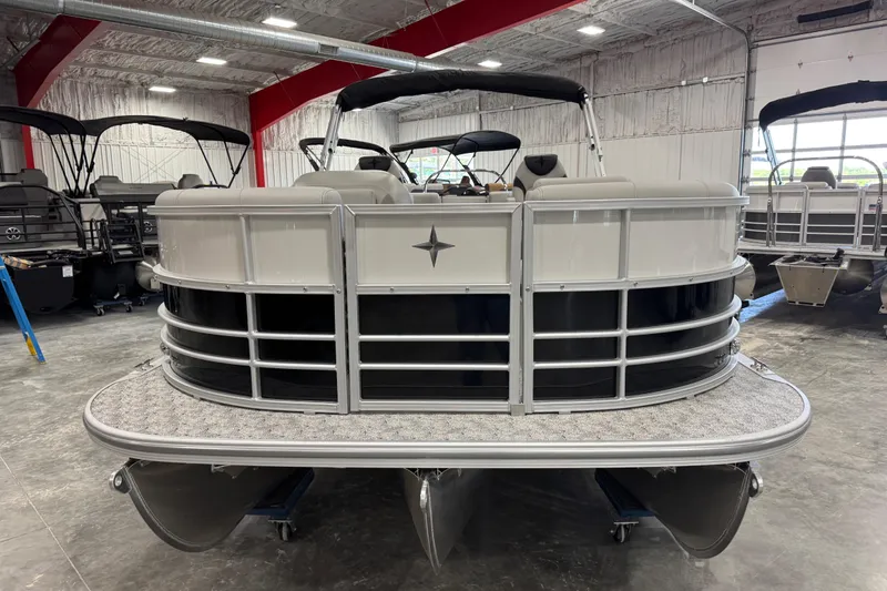 Slide: The Image of 2026 Berkshire 24 RFX LE pontoon boat in showroom, front view. - 6