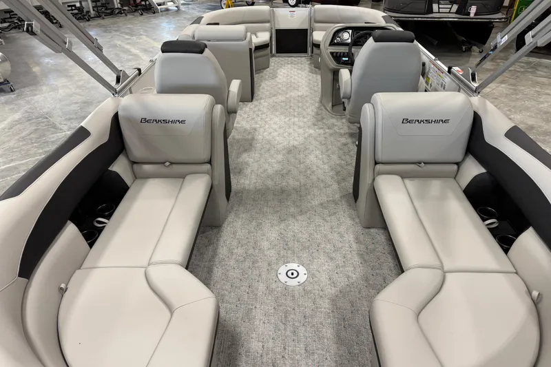 Slide: The Image of 2026 Berkshire 24 RFX LE pontoon boat interior with plush seating and modern design. - 8