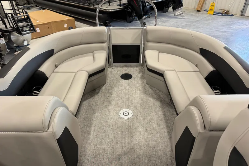 Slide: The Image of 2026 Berkshire 24 RFX LE pontoon boat interior with plush seating and modern design. - 9