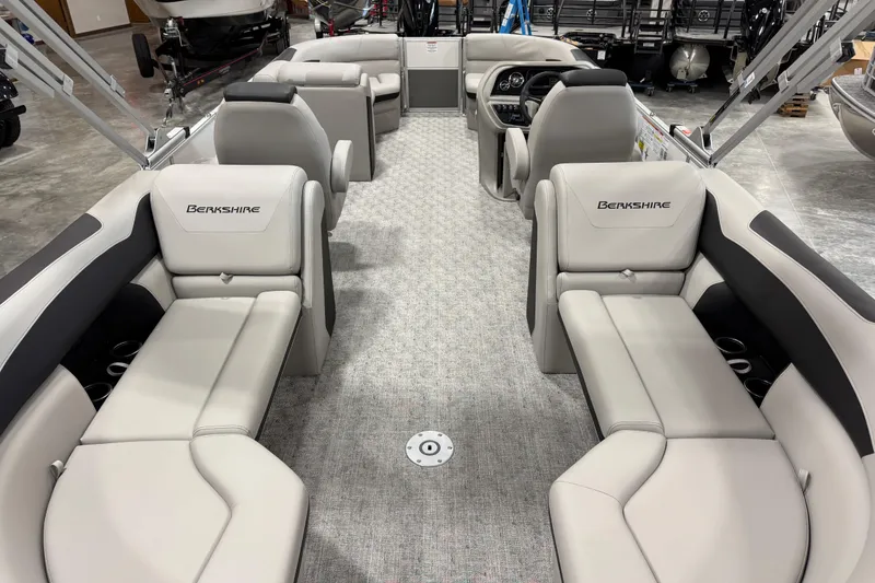 Slide: The Image of 2026 Berkshire 24RFX LE pontoon boat interior with plush seating and modern design. - 10