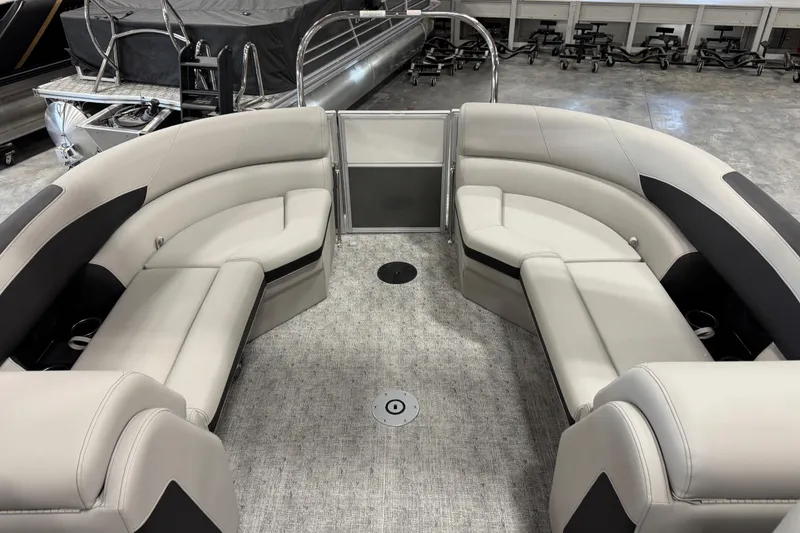 Slide: The Image of 2026 Berkshire 24RFX LE pontoon boat interior with plush seating and modern design. - 11