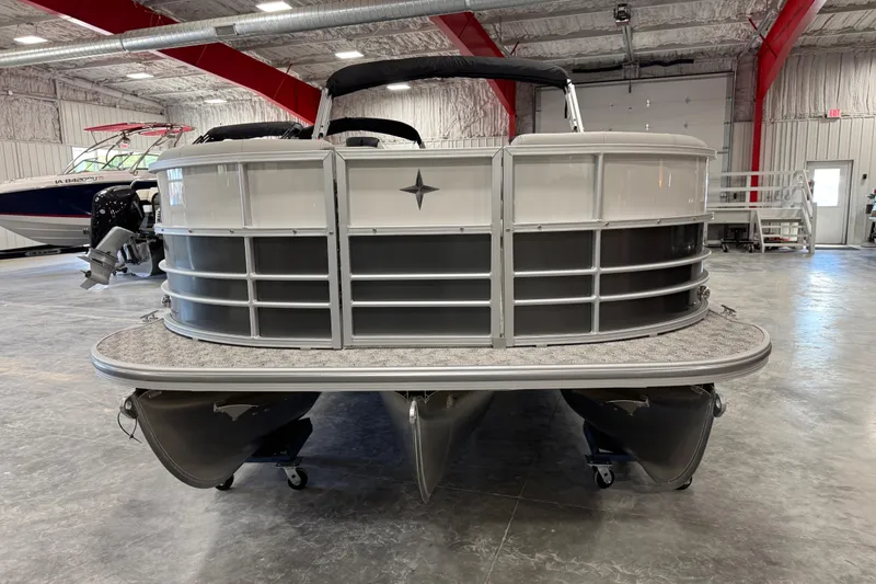 Slide: The Image of 2026 Berkshire 24RFX LE pontoon boat in a showroom, front view. - 4