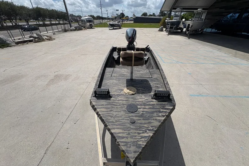 Slide: The Image of 2022 Edge Duck Boats HPSD 1656DB on display outdoors, featuring camouflage design. - 10
