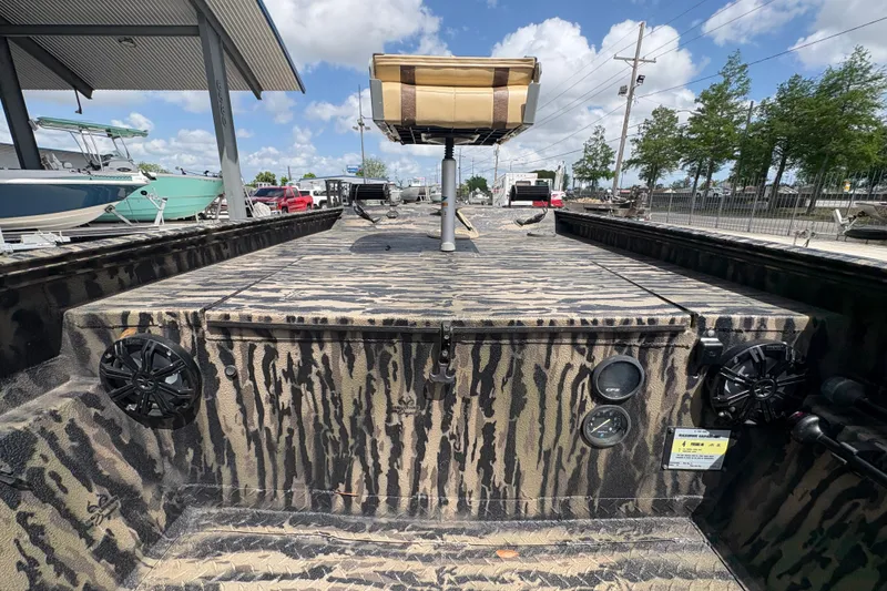 Slide: The Image of 2022 Edge Duck Boats HPSD 1656DB with camouflage design, featuring speakers and gauges. - 12
