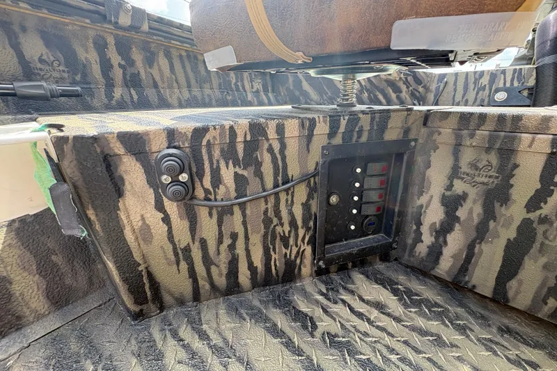 Slide: The Image of 2022 Edge Duck Boats HPSD 1656DB interior with camouflage design and control panel. - 15