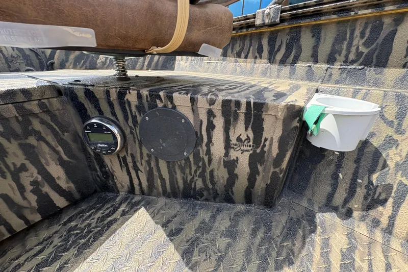 Slide: The Image of 2022 Edge Duck Boats HPSD 1656DB interior with camouflage design and Clarion audio system. - 16