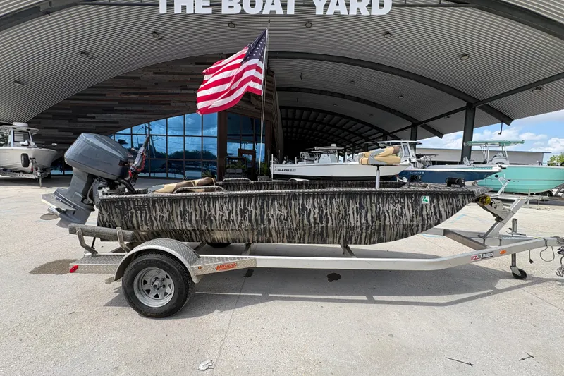 Slide: The Image of 2022 Edge Duck Boats HPSD 1656DB on trailer, American flag, at The Boat Yard. - 2