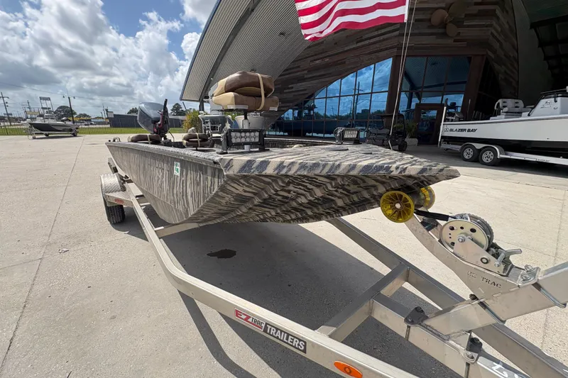 Slide: The Image of 2022 Edge Duck Boats HPSD 1656DB on trailer, parked outdoors under a cloudy sky. - 9