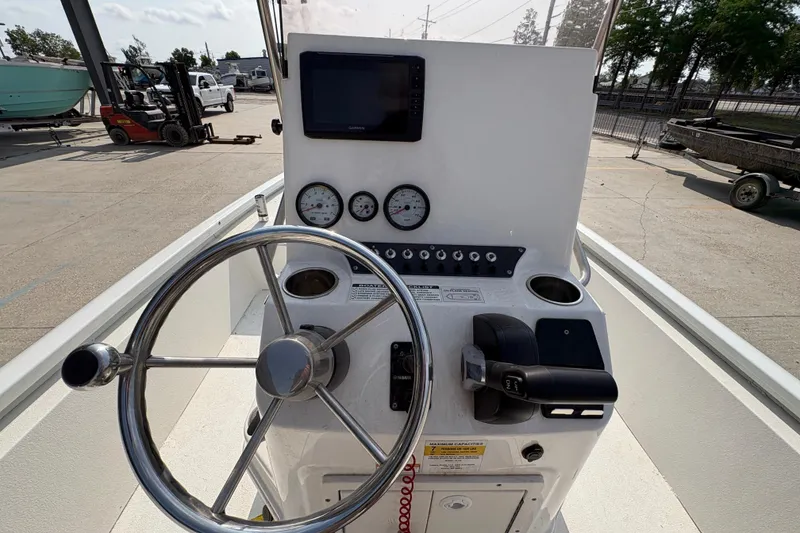 Slide: The Image of Steering console of 2021 Avid 21 FS boat with gauges and controls. - 20