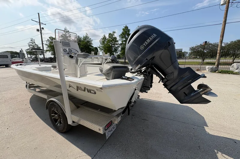 Slide: The Image of Avid 21 FS 2021 boat with Yamaha outboard motor on trailer. - 6