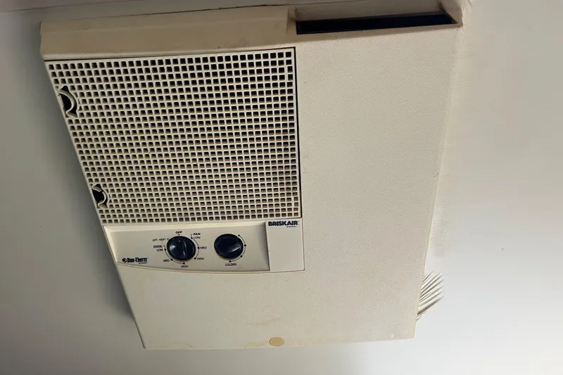 Slide: The Image of Ceiling-mounted Briskair Duo-Therm air conditioning unit with control knobs, model Gibson 44, 1990. - 31