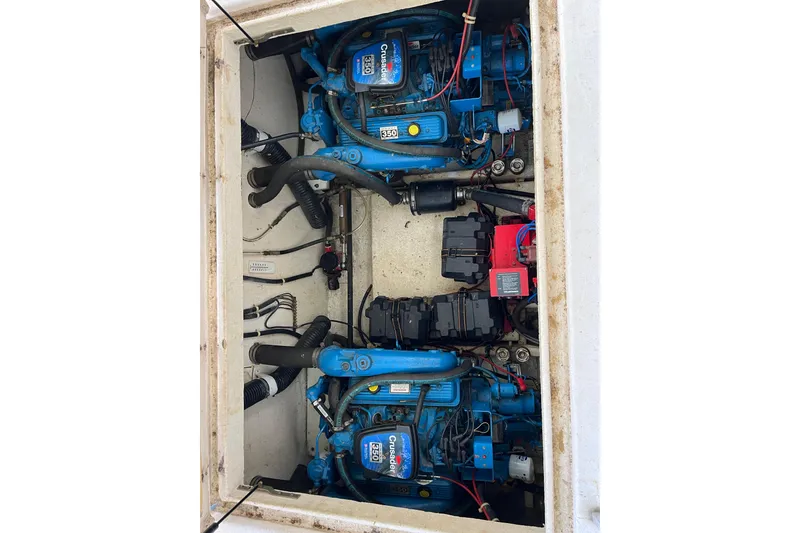 Slide: The Image of Twin Crusader 350 engines in a 1990 Gibson 44 boat engine compartment. - 39