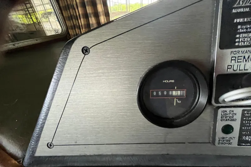 Slide: The Image of Control panel of a 1990 Gibson model 44 with hour meter reading 5087. - 8