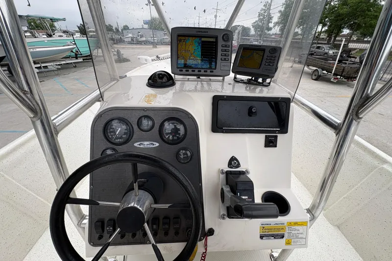 Slide: The Image of 1998 Hydra-Sports 22 Ocean CC boat dashboard with navigation equipment and steering wheel. - 12