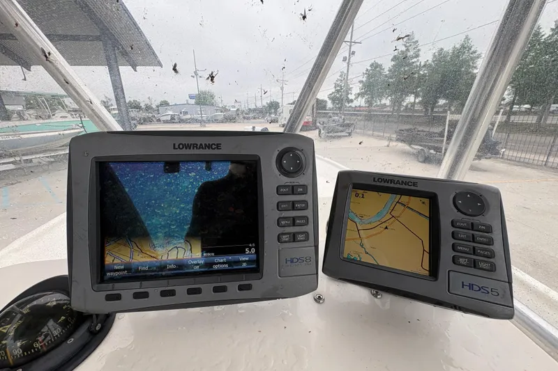 Slide: The Image of Lowrance navigation displays on a 1998 Hydra-Sports 22 Ocean CC boat dashboard. - 13