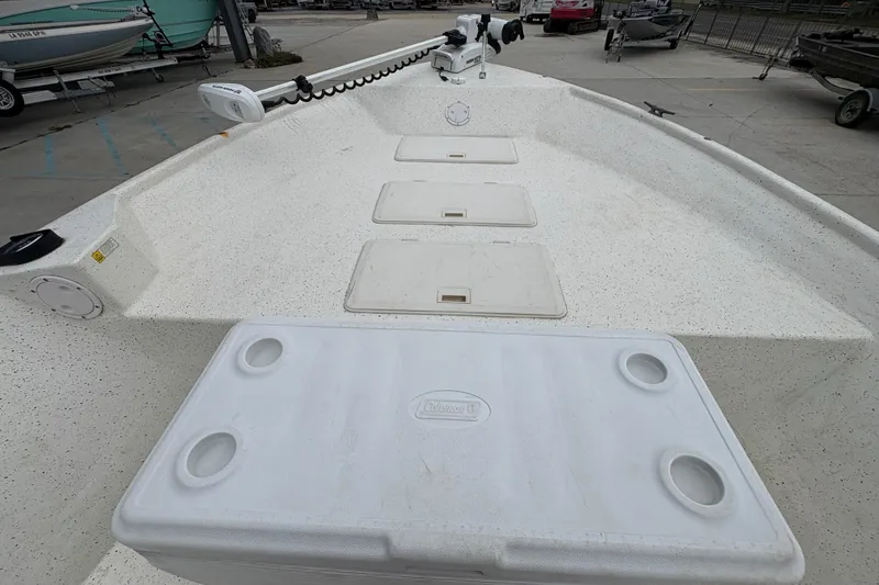 Slide: The Image of 1998 Hydra-Sports 22 Ocean CC boat deck with storage compartments and cooler. - 15