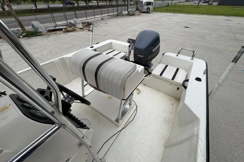Slide: The Image of 1998 Hydra-Sports 22 Ocean CC boat interior with Yamaha engine, parked outdoors. - 18