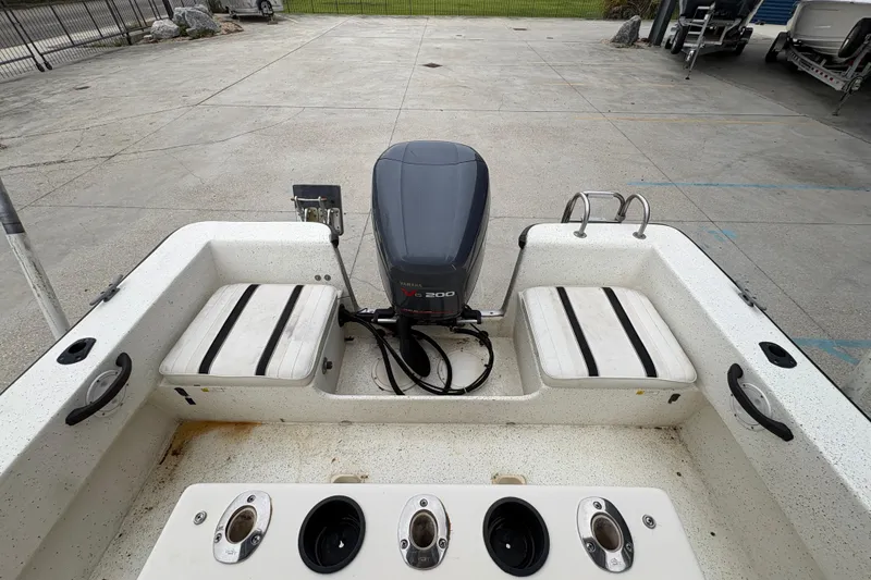 Slide: The Image of 1998 Hydra-Sports 22 Ocean CC boat with Yamaha V6 200 engine, docked on concrete. - 20