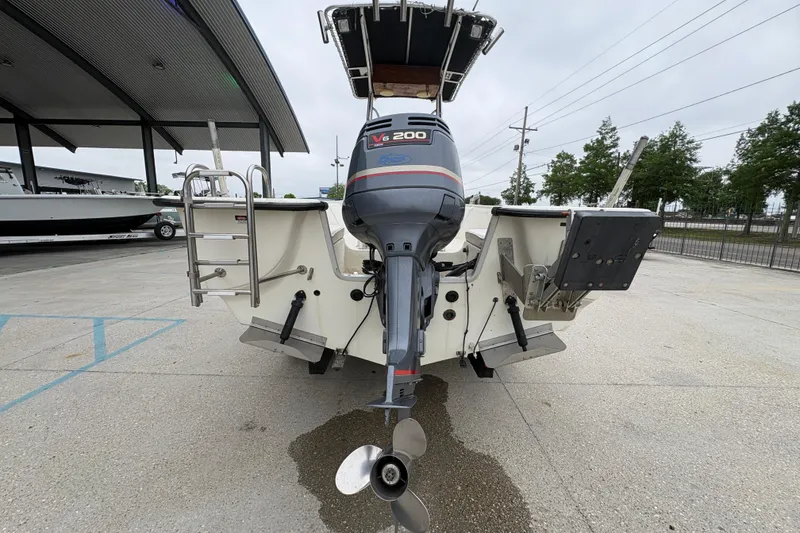 Slide: The Image of 1998 Hydra-Sports 22 Ocean CC boat with V6 200 engine, rear view in parking lot. - 5
