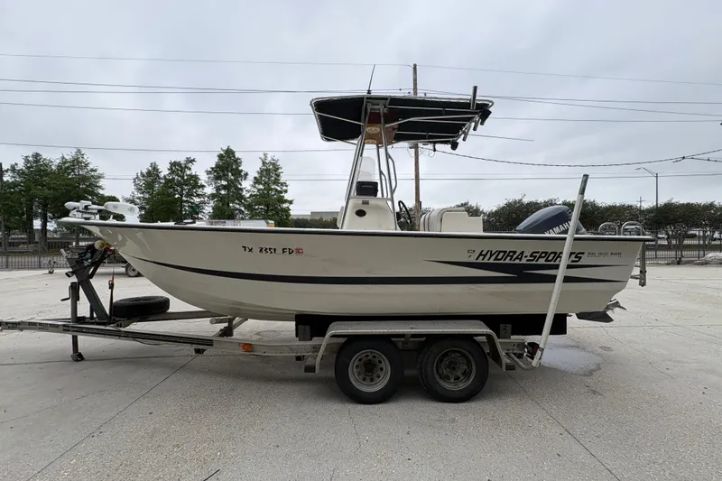 Slide: The Image of 1998 Hydra-Sports 22 Ocean CC boat on trailer, side view, overcast sky. - 7