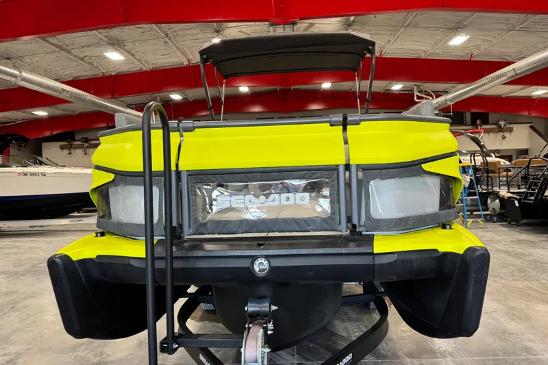 Slide: The Image of 2023 Sea-Doo Switch Cruise 21 in a showroom, showcasing its vibrant yellow design. - 11