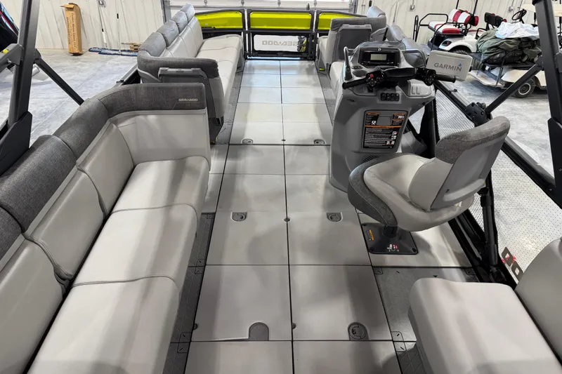 Slide: The Image of 2023 Sea-Doo Switch Cruise 21 interior with spacious seating and modern helm controls. - 14