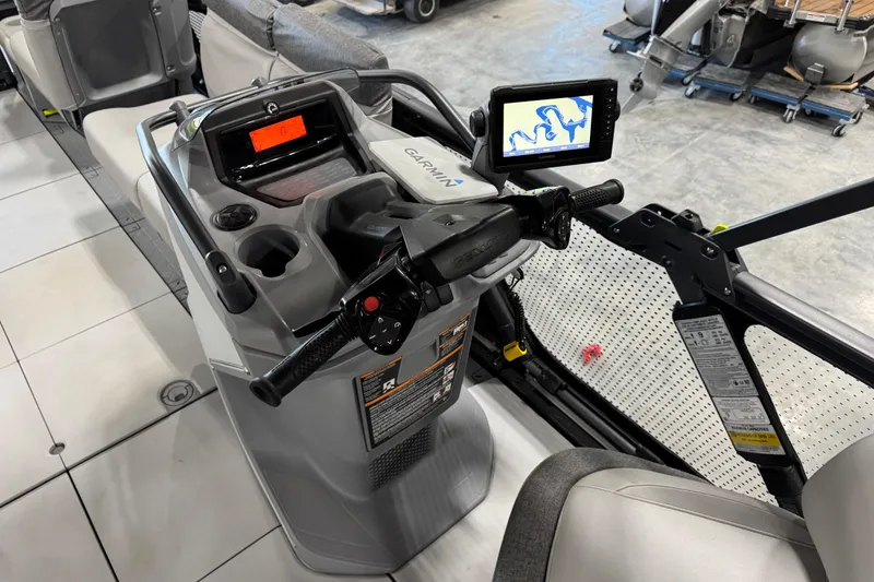 Slide: The Image of 2023 Sea-Doo Switch Cruise 21 dashboard with Garmin navigation system and controls. - 15