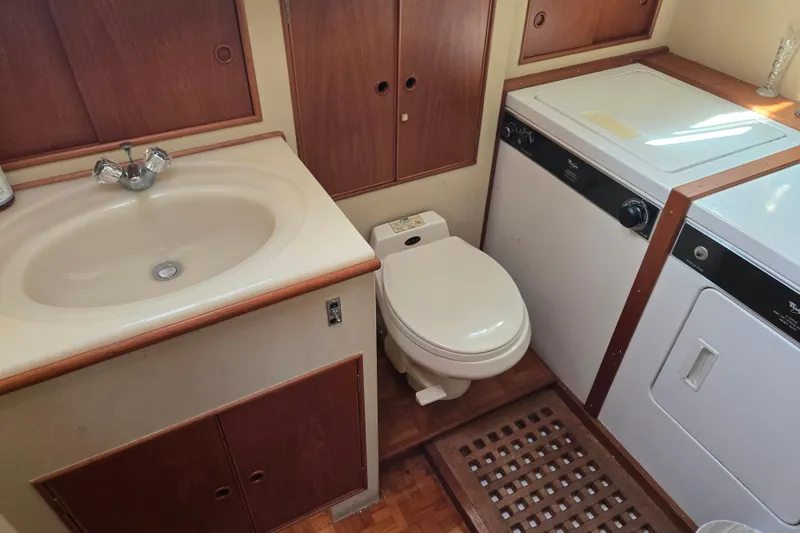 Slide: The Image of Bathroom and laundry area on a 1992 Grand Banks 46 Classic yacht. - 10