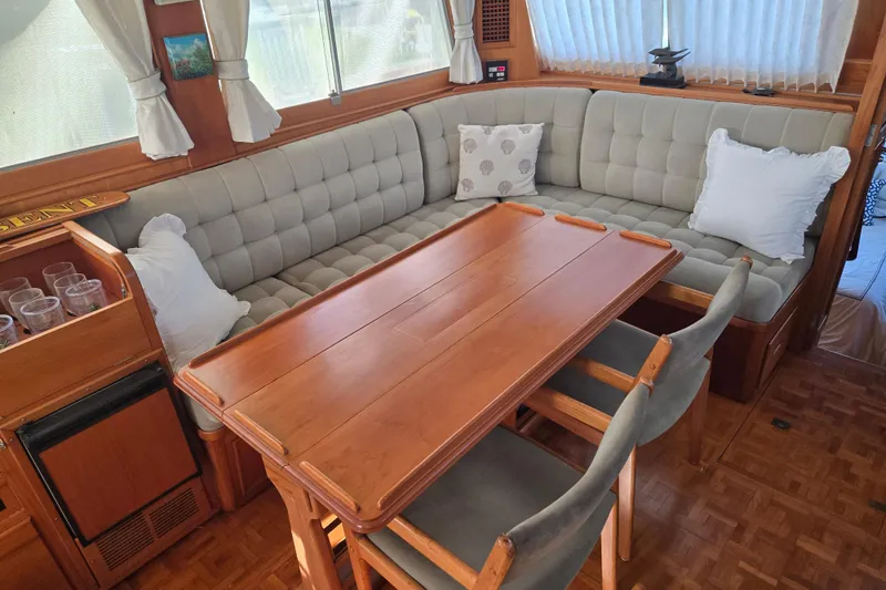 Slide: The Image of Interior of a 1992 Grand Banks 46 Classic yacht with a cozy dining area. - 15