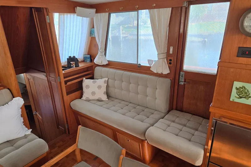 Slide: The Image of Interior of 1992 Grand Banks 46 Classic yacht with cozy seating and wooden accents. - 17
