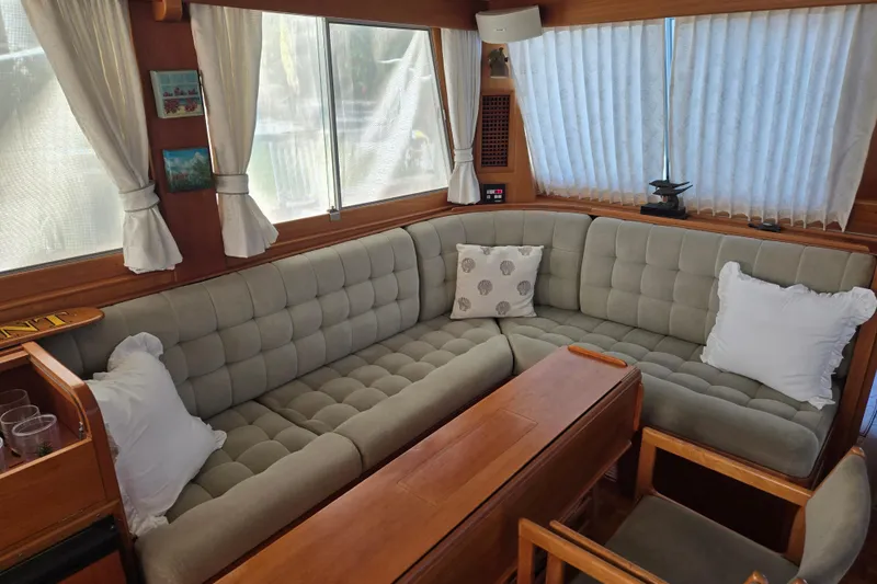 Slide: The Image of Interior of 1992 Grand Banks 46 Classic yacht with cozy seating and wooden accents. - 3
