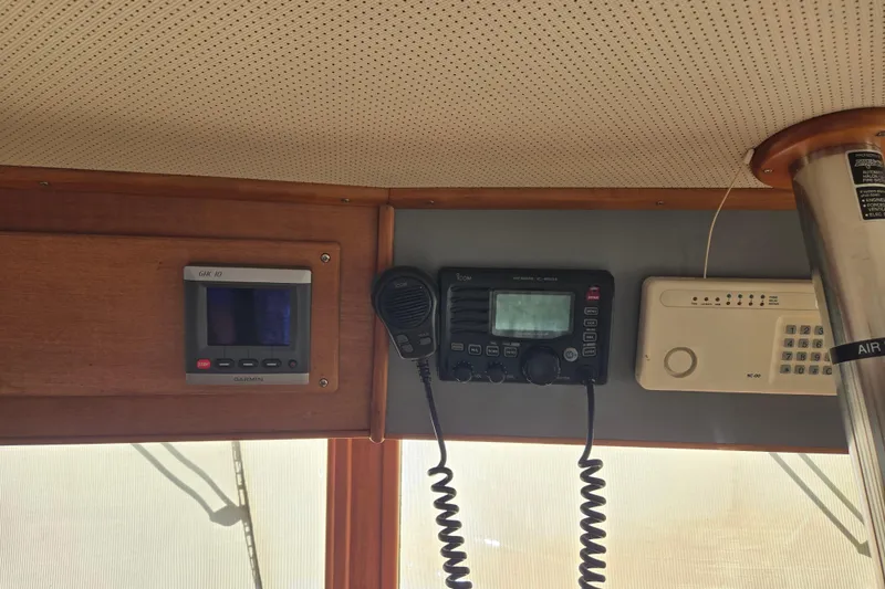 Slide: The Image of Interior electronics of a 1992 Grand Banks 46 Classic yacht, featuring navigation and communication devices. - 36