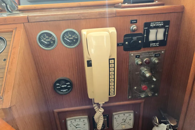 Slide: The Image of Control panel of a 1992 Grand Banks 46 Classic boat with gauges and switches. - 39