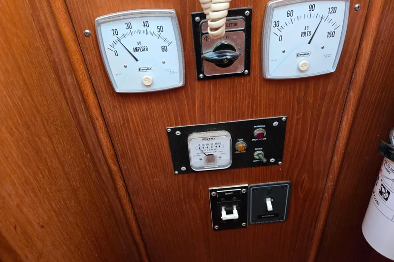 Slide: The Image of Control panel of a 1992 Grand Banks 46 Classic boat with gauges and switches. - 40
