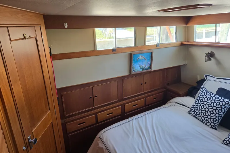 Slide: The Image of Cozy cabin interior of 1992 Grand Banks 46 Classic yacht with wooden cabinetry and nautical decor. - 43