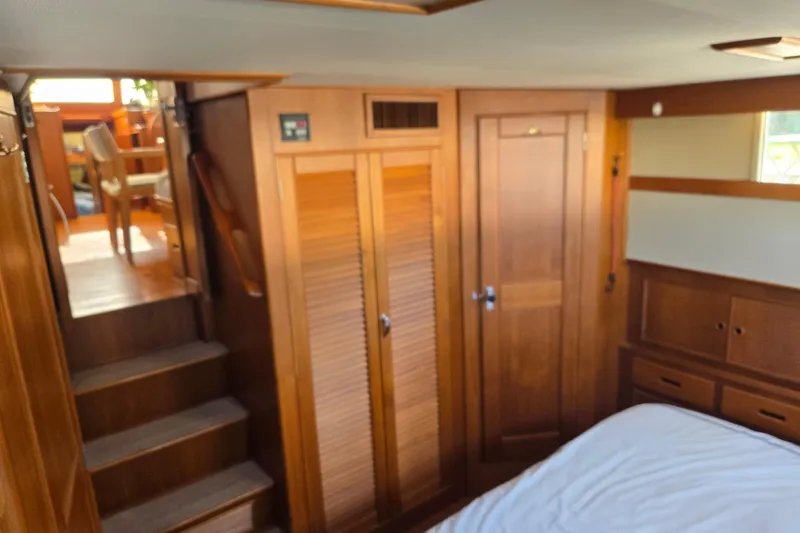 Slide: The Image of Interior of 1992 Grand Banks 46 Classic yacht with wooden cabinetry and stairs. - 45