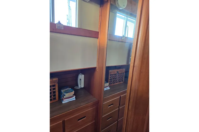 Slide: The Image of Wooden interior of 1992 Grand Banks 46 Classic yacht with mirror and storage. - 47