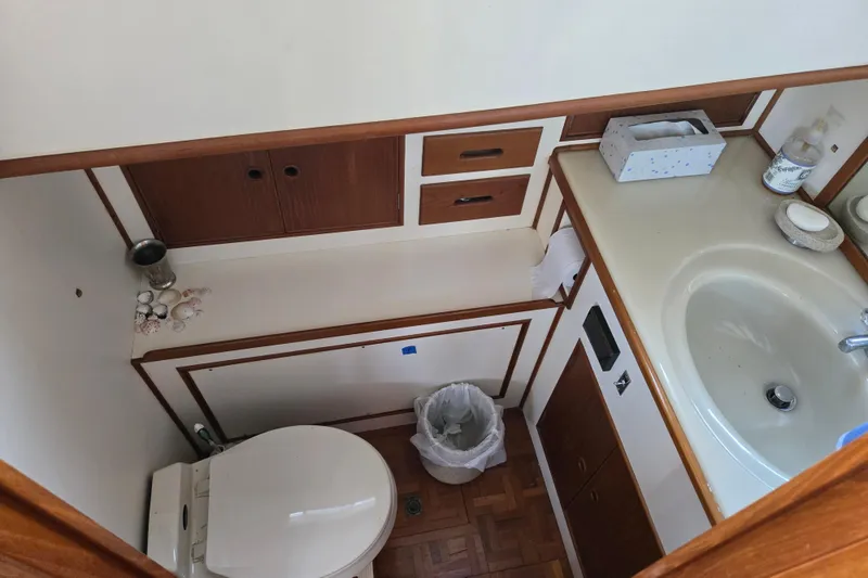 Slide: The Image of Bathroom interior of 1992 Grand Banks 46 Classic yacht with sink and toilet. - 48
